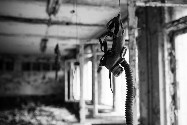 Infected radiation gas mask in an abandoned middle school in Chernobyl nuclear power plant zone of alienation