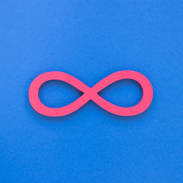 Infinite pink symbol on blue background