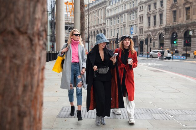 Influencers walking and drinking coffee in the city