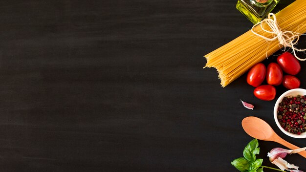 Ingredients for italian pasta on black background