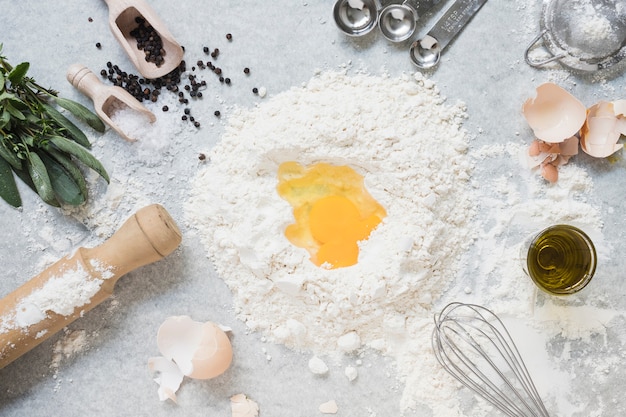 Ingredients for making dough for bread; cake on marble top