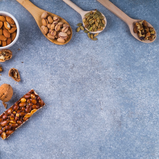 Ingredients for making homemade energy bar on concrete background