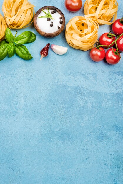 Ingredients for noodles with vegetables on desk