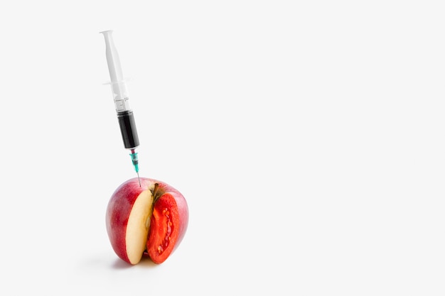 Injecting chemicals into an apple copy space