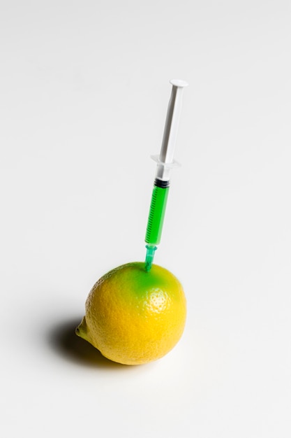 Injecting lemon with green chemicals