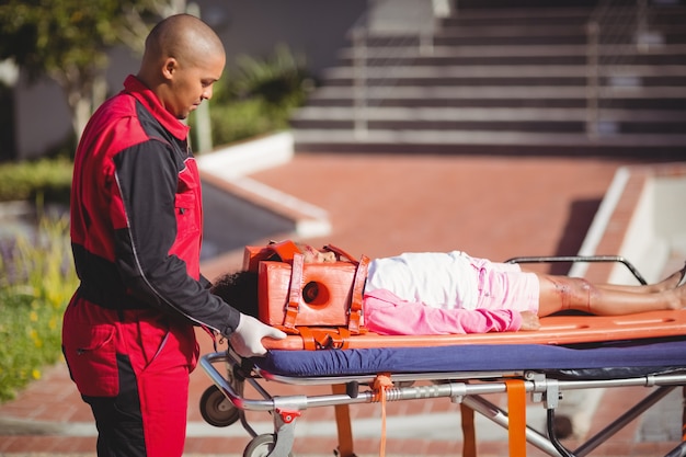 Free photo injured girl treated by paramedic