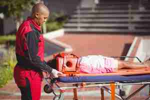 Free photo injured girl treated by paramedic