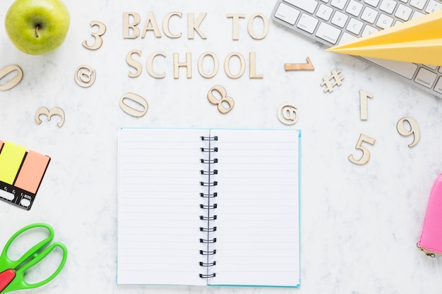 Inscription back to school and stationary on table