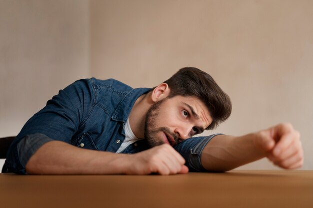 insecure man indoors medium shot