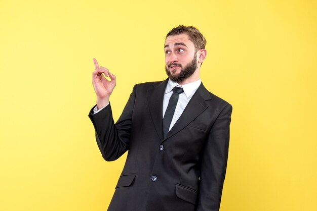 An insecure young man with suit and tie over yellow