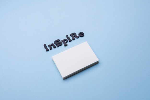 Free Photo inspire word and pile of business cards