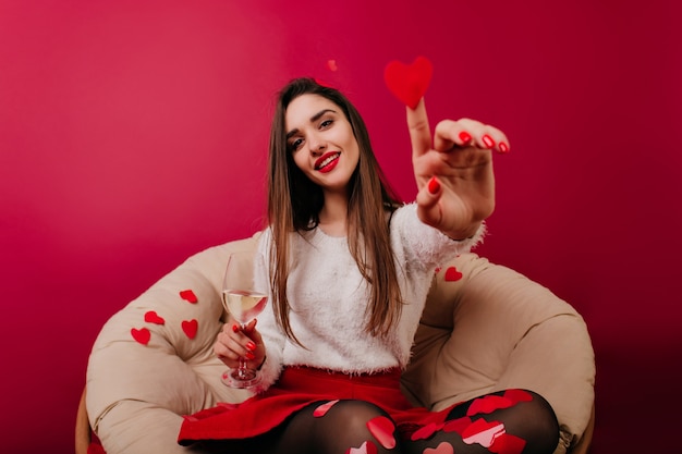 Inspired european girl holding paper heart