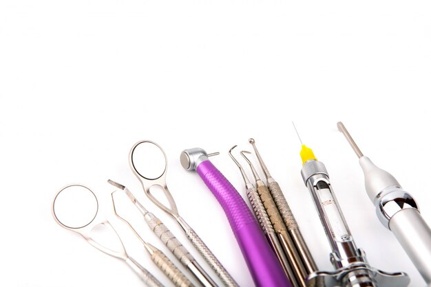 Instruments of a dentist with white background