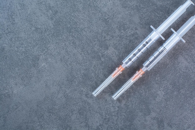 Insulin syringes for diabetes on marble surface