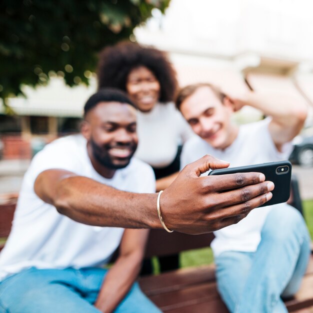 Intercultural friends taking pictures