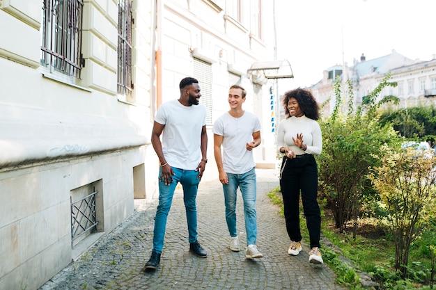 Intercultural friends walking together 