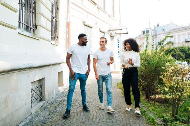 Intercultural friends walking together 