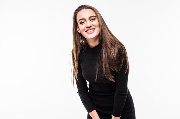 Interested smiling girl in a dark dress Isolated over white.