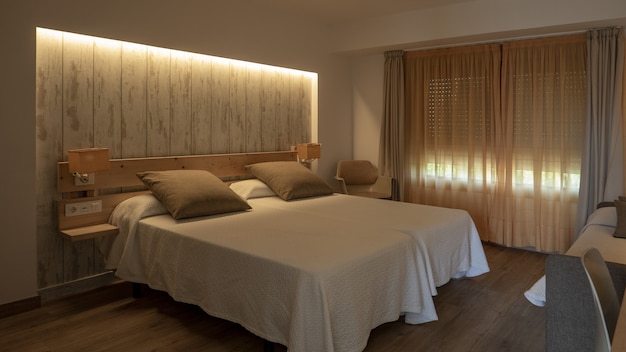 Interior of a bedroom in white and creamy tones