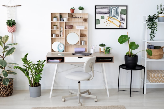 Free Photo interior design with photoframes and desk arrangement