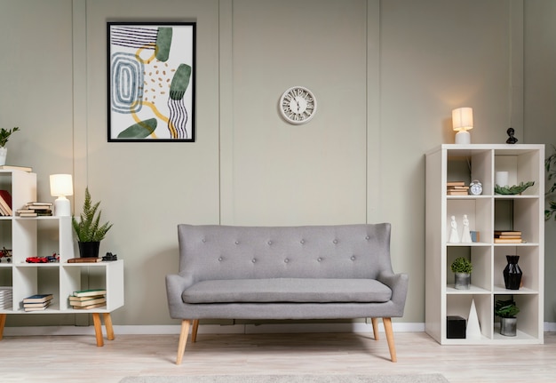 Interior design with photoframes and grey couch