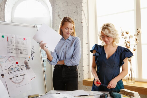 Interior designer working with young couple.