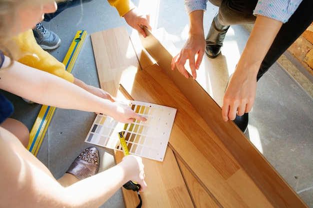 Interior designer working with young couple