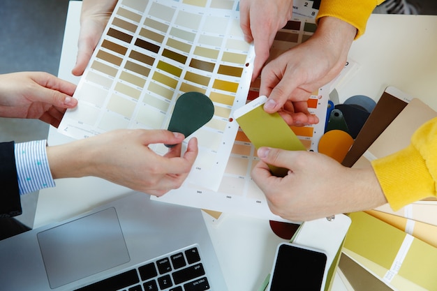 Interior designer working with young couple