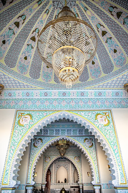 The interior is in traditional Islamic style with a large chandelier and many details and ornaments