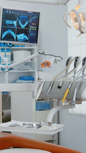 Interior of modern dental office in hospital with dentistry orthodontic furniture zoom in shot of pr...