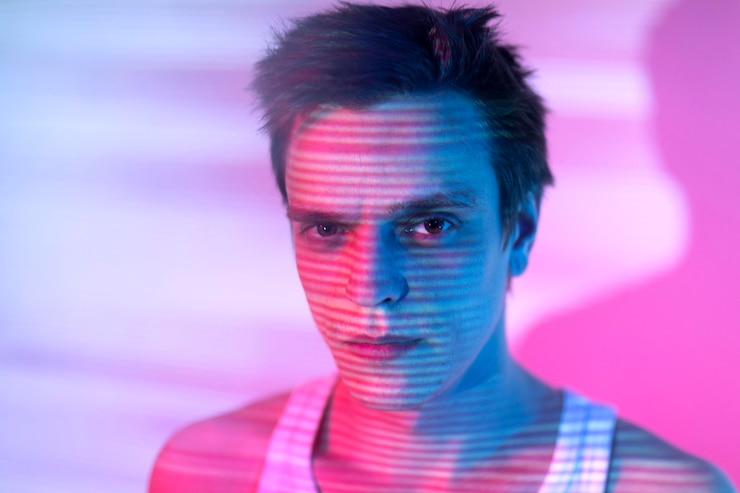 Free Photo interior portrait of handsome man in vaporwave style