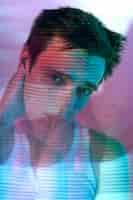 Free photo interior portrait of handsome man in vaporwave style