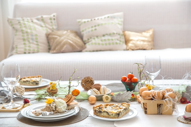 The interior of the room with a festive Easter table .