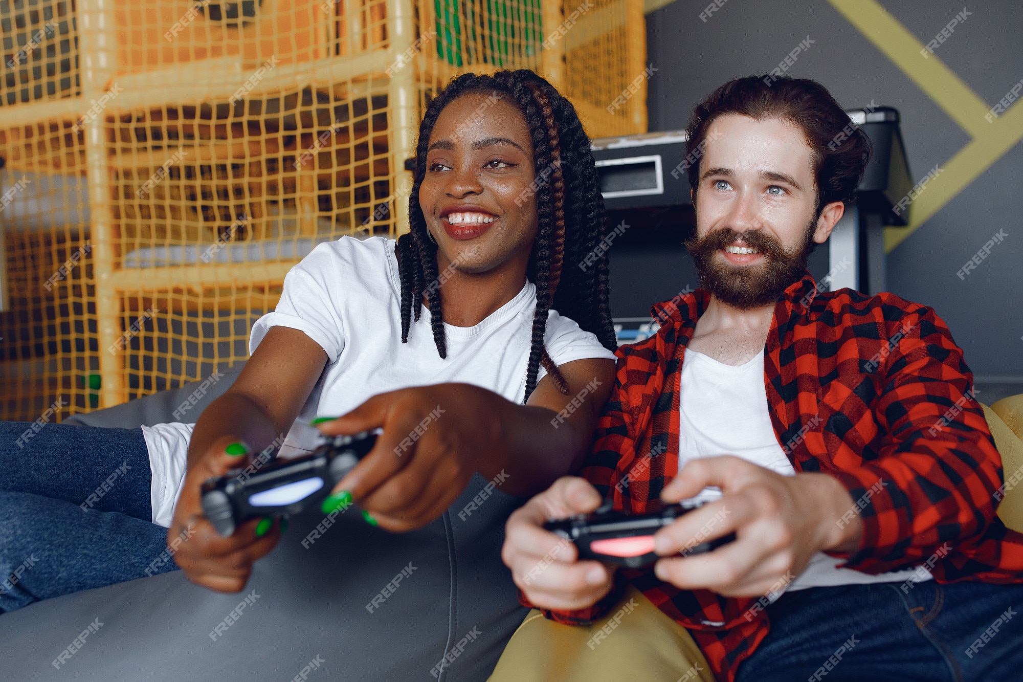 Free: International couple playing a video games Free Photo 