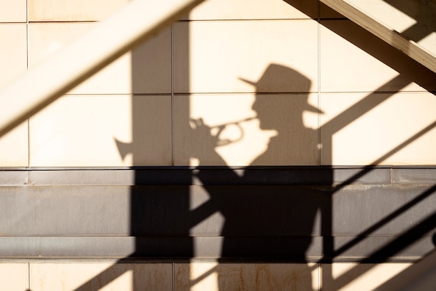 Free photo international jazz day with musician shadow