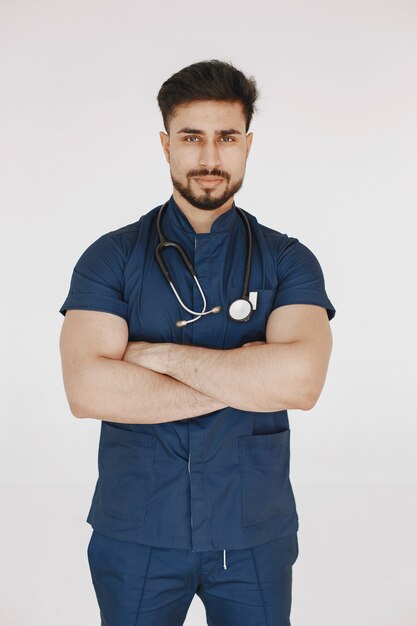 International medical student. Man in a blue uniform. Doctor with stethoscope.