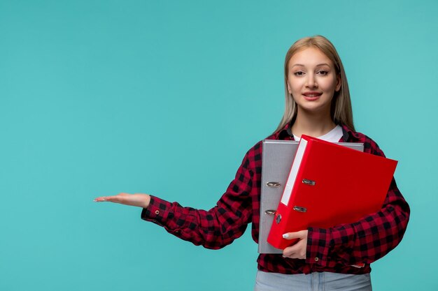 International students day young cute girl in red checked shirt happily holding file folders