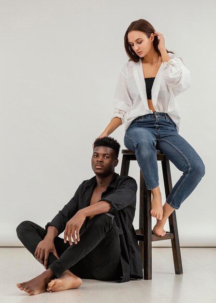 Interracial couple posing full shot