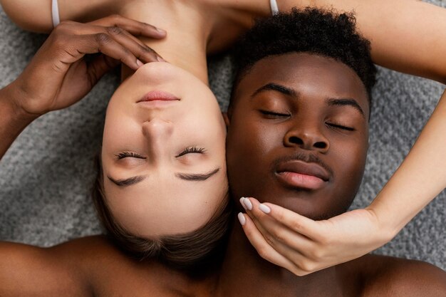 Interracial couple posing top view