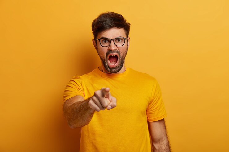 Free Photo irritated bearded young man shouts angrily, accuses someone