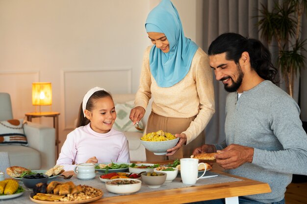 Islamic family with delicious food medium shot