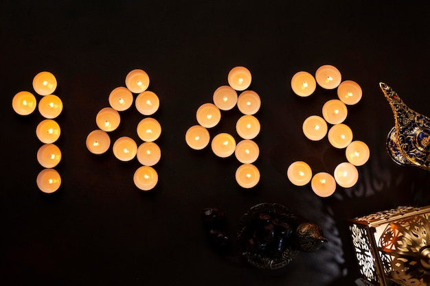 Islamic new year decoration with number made of small candles