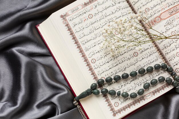 Islamic new year decoration with praying beads on quran