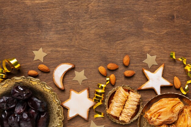 Islamic new year decoration with traditional food and star shaped cookies