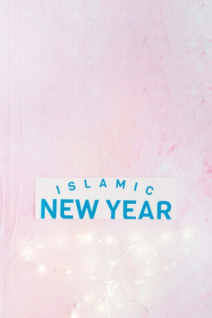 Islamic New Year word and lighting fairy lights 