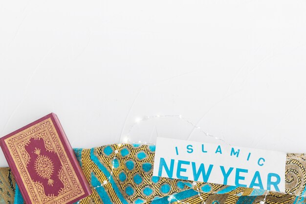 Islamic New Year words and Koran on tablecloth 