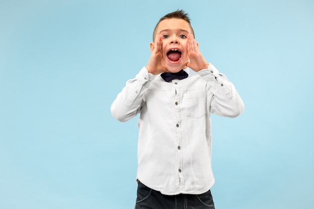 Isolated on pink young casual boy shouting at 