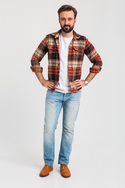 Free photo isolated smiling handsome bearded man in hipster outfit dressed in jeans