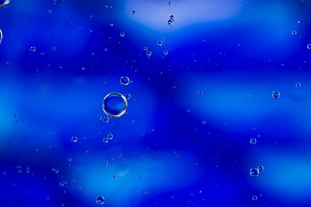 Isolated soap oil bubbles on a watery background