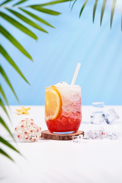 Free photo italian soda strawberry orange on pastel color background exotic summer drinks